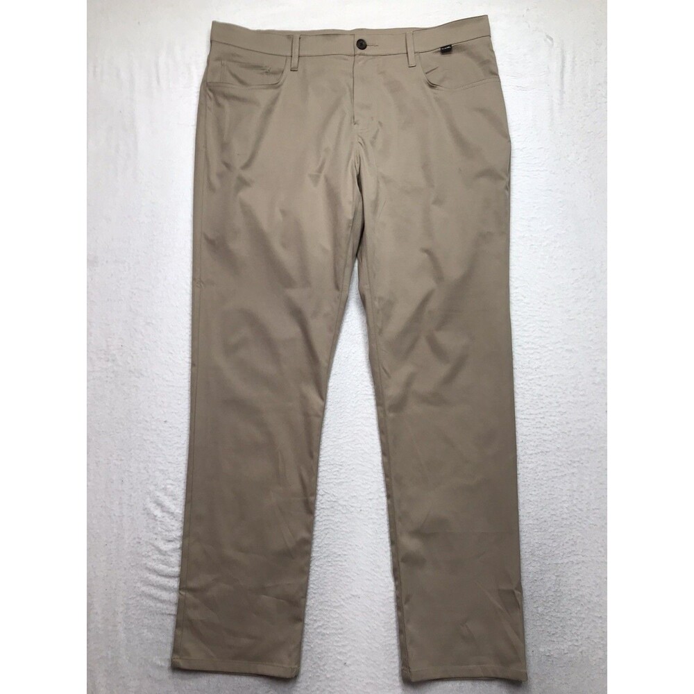 TRAVIS MATHEW Open To Close Golf Pant Men 38(40x32 fit) Tan Performance Stretch